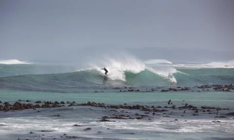 Surfing waves in the Atlantic Ocean Stock Photos