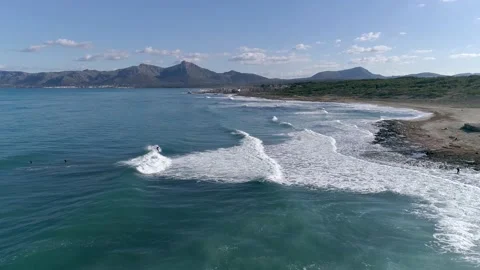 Surfing the Waves of Mallorca: A Bird's Eye View of Beach Bliss Stock Footage 236575475