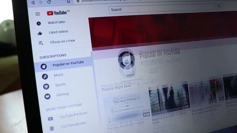 Surfing YouTube website scrolling in browser on laptop Video stock 128634015