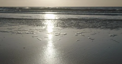 Surfline gently lapping sand Stock Footage 124988845