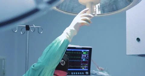 Surgeon adjusting operating room light in a surgery  4k Stock Footage 146163245