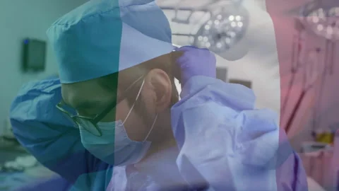 Surgeon adjusting surgical cap in operating room, showing animated health chart Stock Footage 307466525