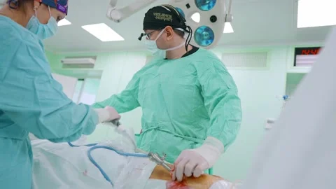 Surgeon and an assistant perform an endoscopic operation Stock Footage 173160816