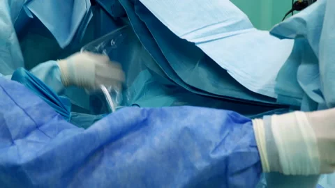 The surgeon and the assistant pull up the screen before the operation 스톡 동영상 164626352