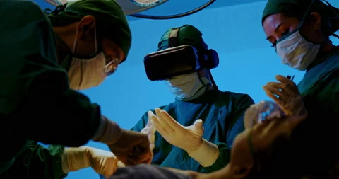 Surgeon and Group doctor assistant are performing abdominal surgery on patients  Stock Footage 198632977