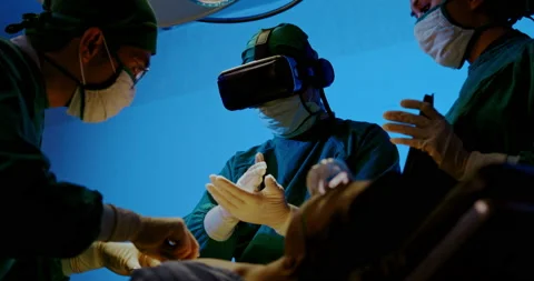 Surgeon and Group doctor assistant are performing abdominal surgery on patients  Stock Footage 198633207