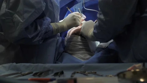 Surgeon and surgical tools closeup 動画素材 204741384