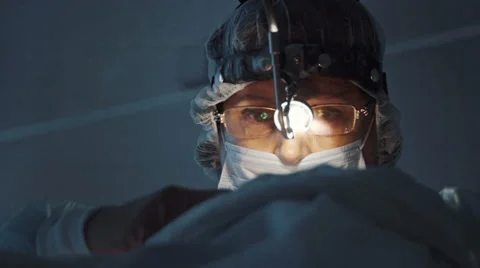 Surgeon close up face.Surgeon performing operation in hospital Stock Footage 67341518
