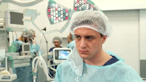 Surgeon completes a successful operation Stock Footage 311944795
