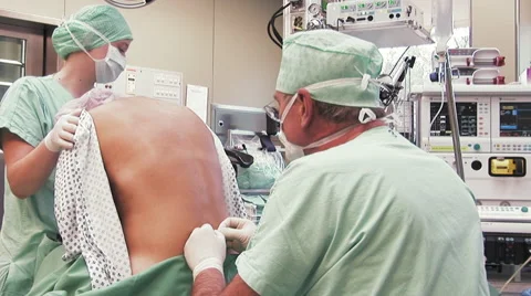 Surgeon is doing a spinal anesthesia Stock Footage 67279626