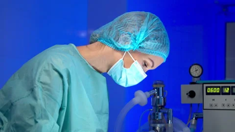 Surgeon doing surgery in operating room in hospital Stock Footage 140757213