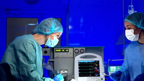 Surgeon doing surgery in operating room in hospital Stock Footage 140762490