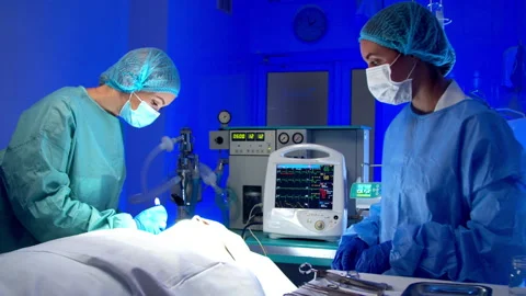 Surgeon doing surgery in operating room in hospital Stock Footage 140762706