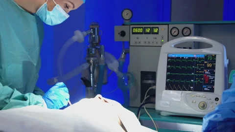 Surgeon doing surgery in operating room in hospital Stock Footage 140764712