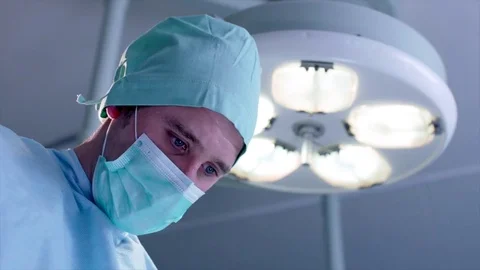 Surgeon during the operation, slow Stock Footage 75248142