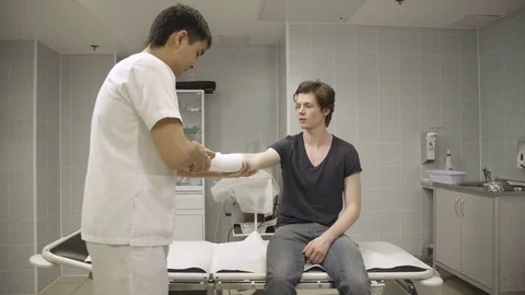 Surgeon examines patient Stock Footage 73023646