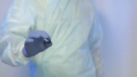 The surgeon extends a tablet on the palm of the hand, which must be delivered to Video stock 92863657