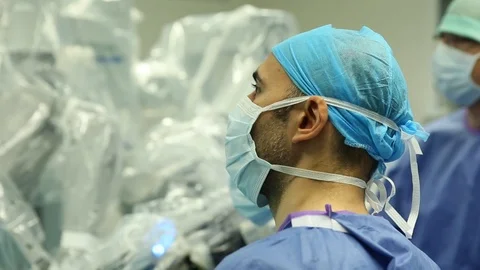 Surgeon faces looking at the medical screen Stock Footage 85924334
