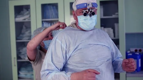 Surgeon getting ready to operate a patient Stock Footage 71982702