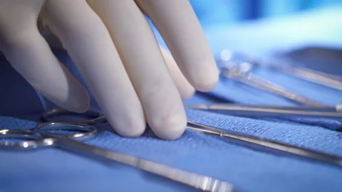 Surgeon Grabs Instrument Rack Focus Close Up Stock Footage 171141180