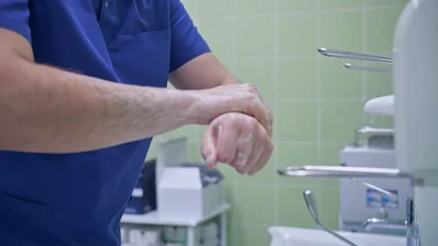 Surgeon handles hands before surgery Stock Footage 150890257
