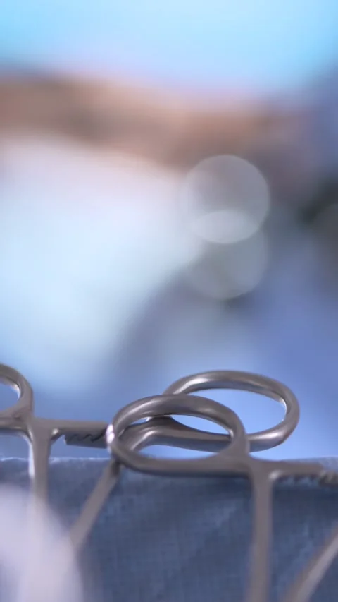 Surgeon With Instruments In Foreground. Vertical Format Stock Footage 328667898