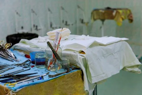 The surgeon in the instruments of surgery in operating room. Stock Photos
