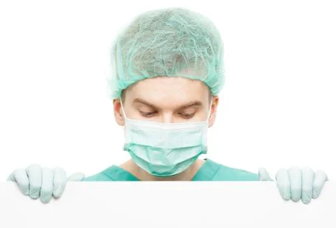 Surgeon looking down from the top of the board below him isolated on white Stock Photos