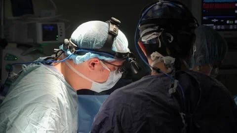 The surgeon makes a decision with colleagues before starting the operation. Stock Footage 137216652