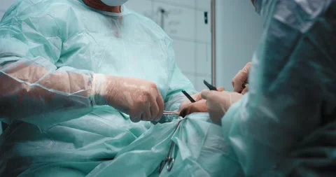 Surgeon makes a suture with surgical thread on the upper part of the eyelid. Stock Footage 199600766