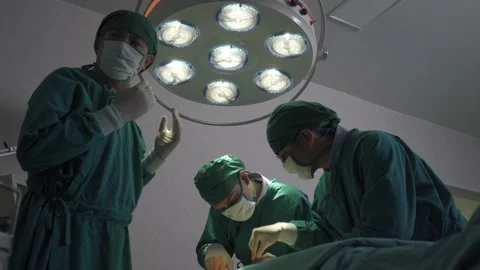 Surgeon operating chest open in surgery room Stock Footage 156683587