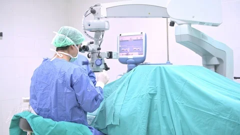 Surgeon operating lasik machine. Stock Footage 92348639