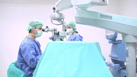 Surgeon operating lasik machine. Stock Footage