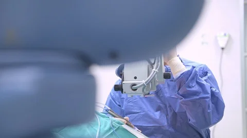 Surgeon operating lasik machine portrait. Stock Footage 92358646