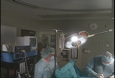 Surgeon in operating room - 3 shot Stock Footage