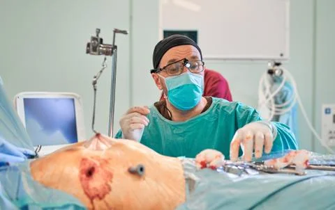 Surgeon in the operating room performs the operation Stock Photos