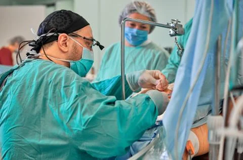 Surgeon in the operating room performs the operation Stock Photos