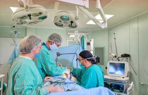 Surgeon in the operating room performs the operation Stock Photos