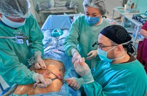 Surgeon in the operating room performs the operation Stock Photos