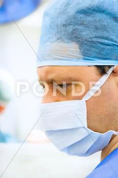 Surgeon in operation room Stock Photos
