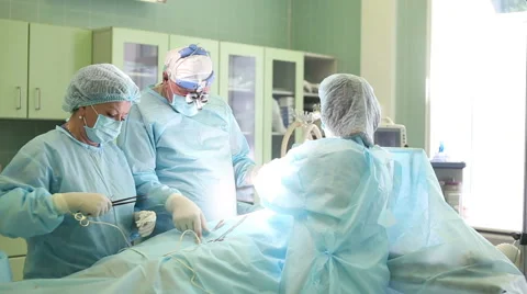 Surgeon performing cosmetic surgery on breasts in operating room. Mammoplasty Stock Footage 50167264