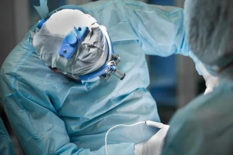 Surgeon performing plastic surgery Stock Photos