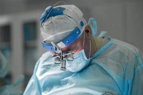 Surgeon performing plastic surgery Stock Photos