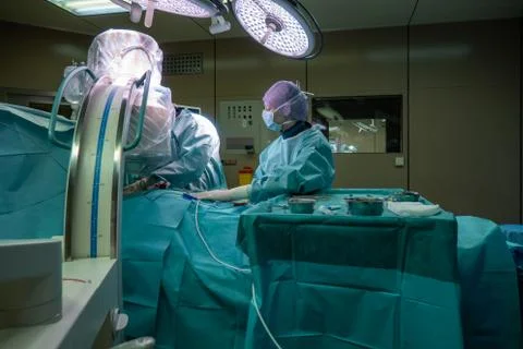 Surgeon performs a defibrillator implantation Stock Photos