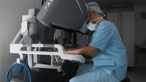 Surgeon performs operation in virtual reality, remotely control robotic arms Stock Footage 240546670