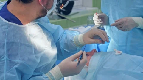 The surgeon performs a surgical operation Stock Footage 150884123