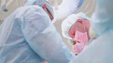 The surgeon performs a surgical operation Stock Footage 150884375