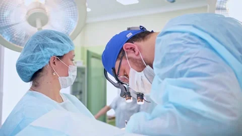 The surgeon performs a surgical operation Stock Footage 150884795