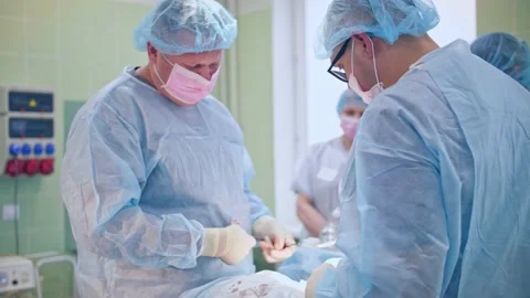 The surgeon performs a surgical operation Stock Footage 150885207