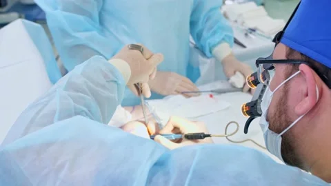 The surgeon performs a surgical operation Stock Footage 150885538